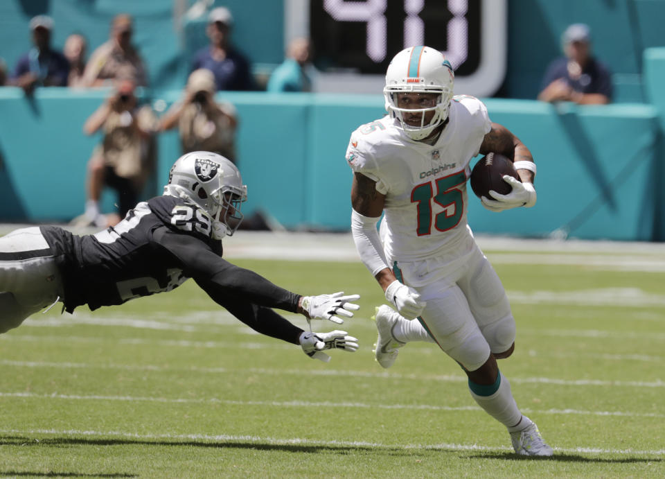 Miami Dolphins wide receiver Albert Wilson (15) runs past Oakland Raiders defensive back Leon Hall (29) during the first half of an NFL football game, Sunday, Sept. 23, 2018, in Miami Gardens, Fla. (AP Photo/Lynne Sladky)