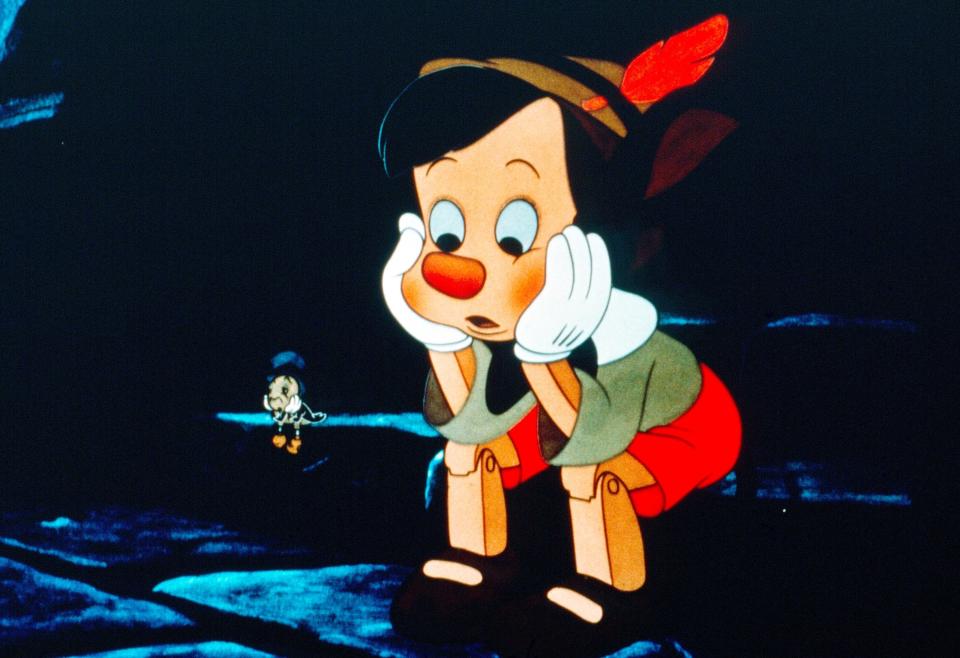 Pinocchio and Jiminy Cricket looking sad together