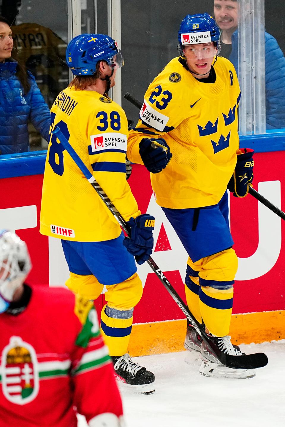 Sweden's Lucas Raymond, right, celebrates with Rasmus Sandin after scoring a goal during the Group A match against Hungary at the World Championship in Tampere, Finland, on Thursday, May 18, 2023.