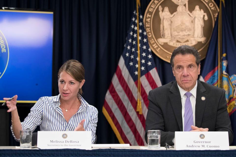 In this Sept. 14, 2018 file photo, Secretary to the Governor Melissa DeRosa, is joined by New York Gov. Andrew Cuomo as she speaks to reporters during a news conference, in New York. De Rosa, Cuomo's top aide, told top Democrats frustrated with the administration's long-delayed release of data about nursing home deaths that the administration "froze" over worries about what information was "going to be used against us," according to a Democratic lawmaker who attended the Wednesday, Feb. 10, 2021 meeting and a partial transcript provided by the governor's office. (AP Photo/Mary Altaffer, File)