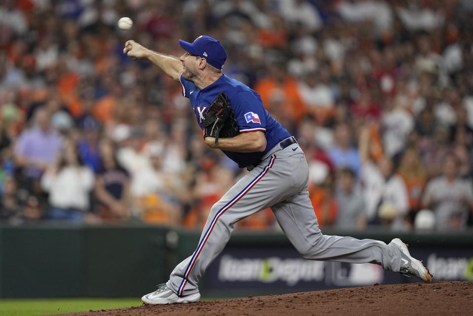 Texas Rangers starter Max Scherzer throws during the first inning of Game 7 of the baseball AL Championship Series against the Houston Astros Monday, Oct. 23, 2023, in Houston. (AP Photo/David J. Phillip)