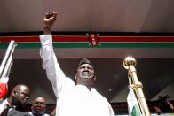 <p>Kenyan opposition leader Raila Odinga of the National Super Alliance (NASA) raises his fist before taking a symbolic presidential oath of office in Nairobi, Kenya, Jan. 30, 2018.<br> (Photo: Baz Ratner/Reuters) </p>