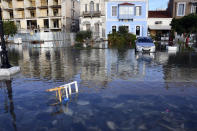 Seawater covers a road after an earthquake at the port of Vathi on the eastern Aegean island of Samos, Greece, Friday, Oct. 30, 2020. A strong earthquake struck in the Aegean Sea between the Turkish coast and the Greek island of Samos as the magnitude 6.6 earthquake was centered in the Aegean at a depth of 16.5 kilometers, or 10.3 miles.(AP Photo/Michael Svarnias)