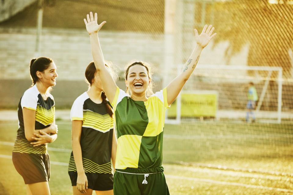 female soccer player celebrating after goal