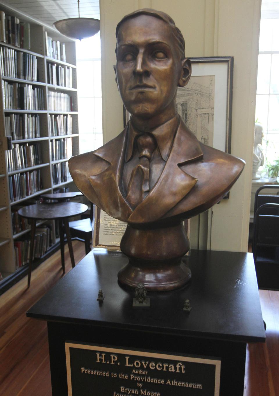 A portrait bust of horror and fantasy writer H.P. Lovecraft greets visitors to the Providence Athenaeum. A statue of the Providence native by a local artist has been commissioned and awaits a permanent home.