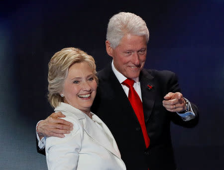 U.S. Democratic presidential nominee Hillary Clinton stands with her husband, former President Bill Clinton, after accepting the nomination on the final night of the Democratic National Convention in Philadelphia, Pennsylvania, U.S. July 28, 2016. REUTERS/Mike Segar/File Photo