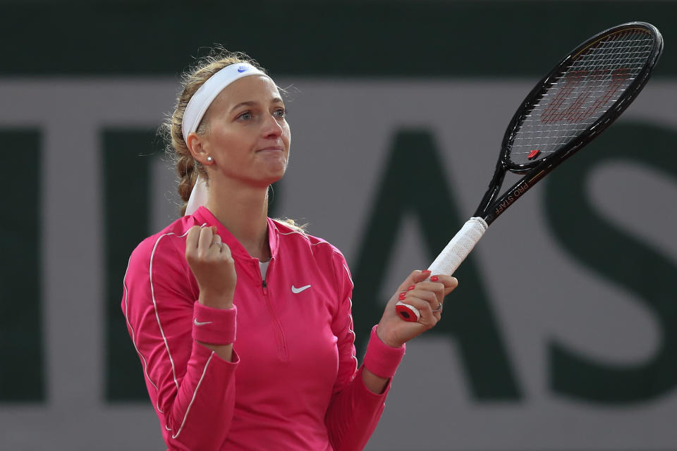 Petra Kvitova of the Czech Republic celebrates winning her fourth round match of the French Open tennis tournament against China's Zhang Shuai in two sets 6-2, 6-4, at the Roland Garros stadium in Paris, France, Monday, Oct. 5, 2020. (AP Photo/Michel Euler)