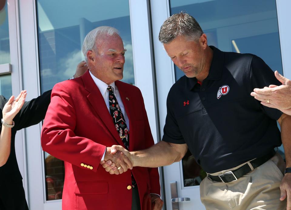 Spencer F. Eccles shakes hands with Coach Kyle Whittingham at the Grand opening of the new Spence and Cleone Eccles Football Center at the University of Utah in Salt Lake City on Thursday, Aug. 15, 2013. | Kristin Murphy, Deseret News