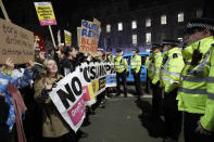 People attend an anti-Boris Johnson demonstration, in central London, Friday Dec. 13, 2019. Boris Johnson's gamble on early elections paid off as voters gave the UK prime minister a commanding majority to take the country out of the European Union by the end of January, a decisive result after more than three years of stalemate over Brexit. (AP Photo/Kirsty Wigglesworth)