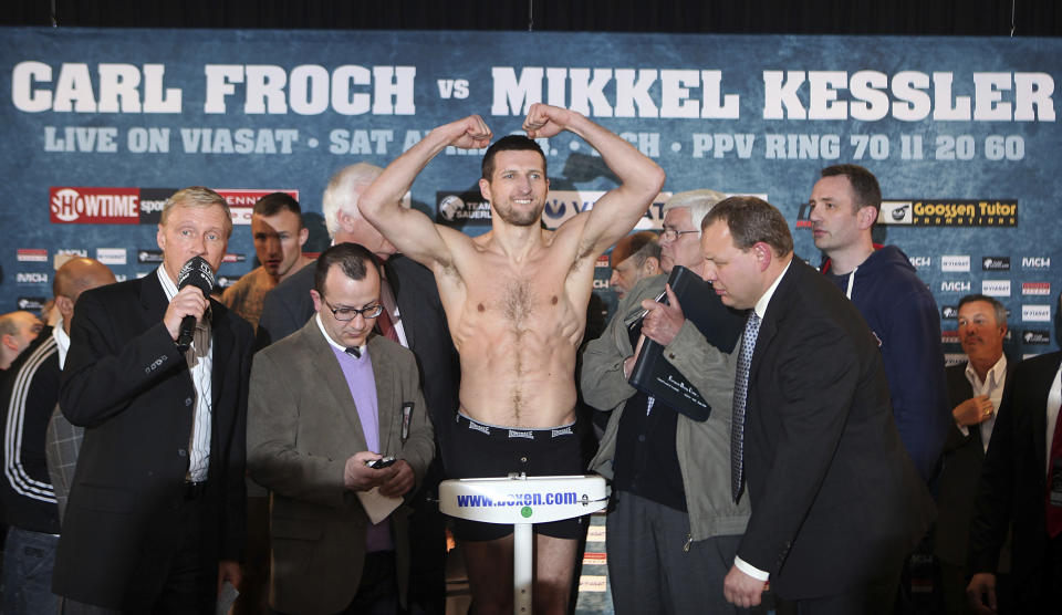 FILE - Britain's World Super Middleweight champion Carl Froch raises his arms during his weigh-in for his title fight against Mikkel Kessler in Herning, Denmark Friday April 23, 2010. Froch was inducted Wednesday, Dec. 7, 2022, to the International Boxing Hall of Fame. (AP Photo/Simon Dawson, File)