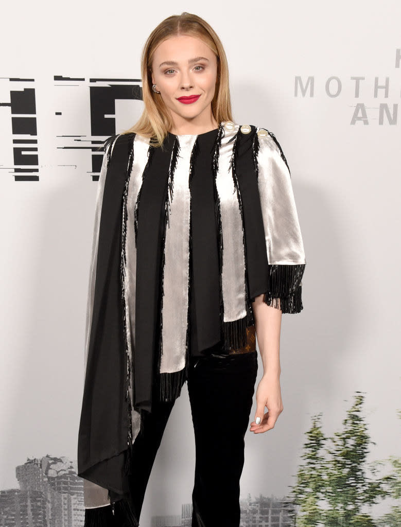 Chloe in an asymmetrical top for an event