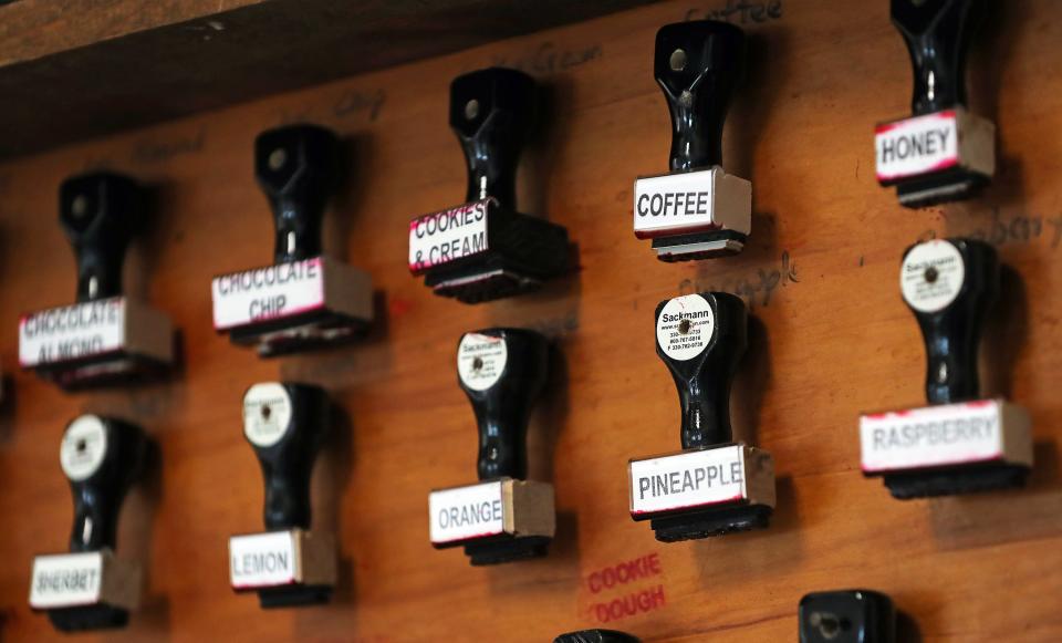 Stamps used to mark boxes of ice cream hang on the wall in the ice cream-making room at Country Maid in Richfield.