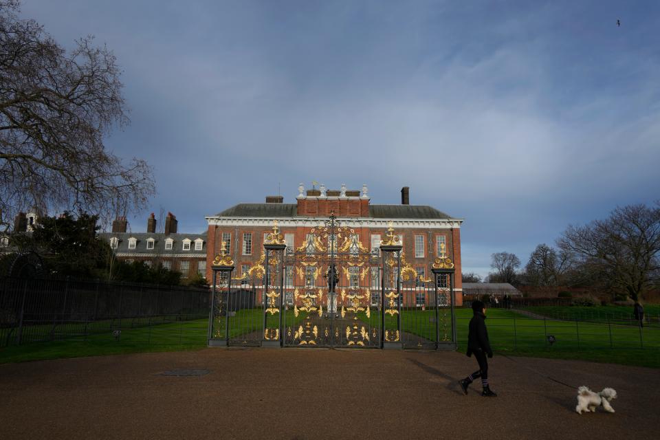 A dog walker passes Kensington Palace in London, Friday, Jan. 6, 2023. The first official photo of Kate, the Princess of Wales, since she underwent abdominal surgery nearly two months earlier, was pulled from circulation by The Associated Press and several other news organizations, Sunday, March 10, 2024, because the image appeared to have been manipulated.