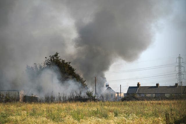 A fire in the village of Wennington, east London, in the heatwave