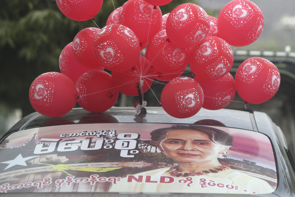 A vehicle is adorned with red balloons and an image of deposed Myanmar leader Aung San Suu Kyi in Mandalay, Myanmar, on Feb. 6, 2021. Protests in Myanmar against the military coup that removed Suu Kyi’s government from power have grown in recent days despite official efforts to make organizing them difficult or even illegal. (AP Photo)