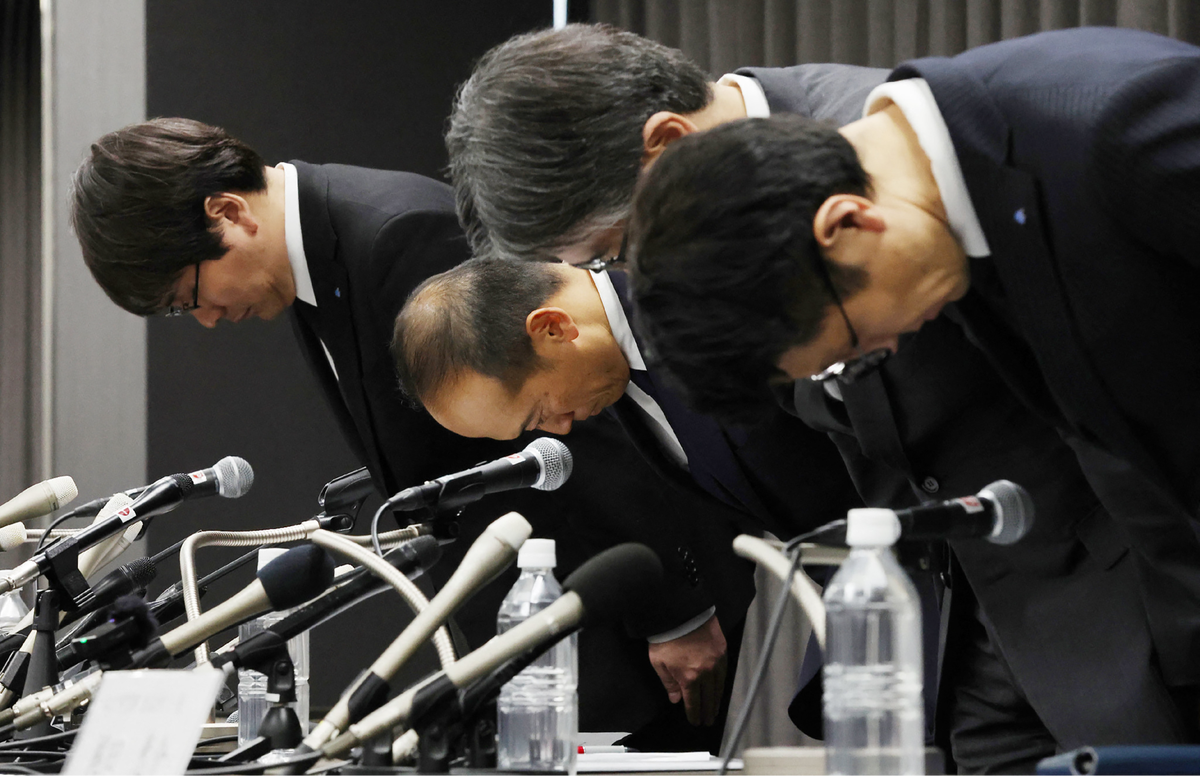 Executives from Kobayashi Pharmaceutical bow to apologise for the company's behaviour in a health supplement scandal that has killed five people and left more than 100 in hospital (JIJI Press/AFP via Getty Images)