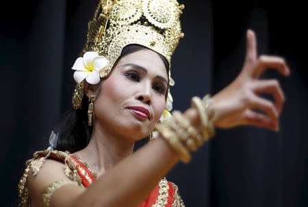 Cheth Chan Chrisna, a former Cambodian refugee who now goes by her married name Chrisna Ito, rehearses a traditional Cambodian dance during photo opportunities at Asia Sports Festa in Yokohama, south of Tokyo, Japan, October 25, 2015. Picture taken October 25, 2015. REUTERS/Yuya Shino