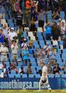 Australia's batsman David Warner, raises his bat as he leaves the field after being dismissed for 115 runs on the third day of their cricket test match against South Africa at Centurion Park in Pretoria, South Africa, Friday, Feb. 14, 2014. (AP Photo/ Themba Hadebe)