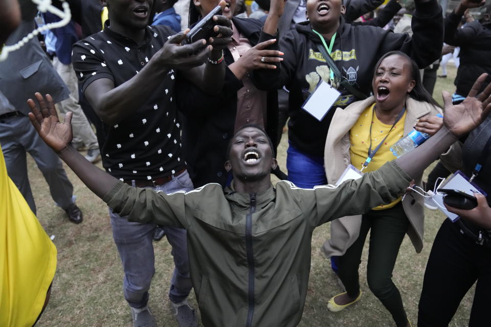 Supporters of Kenyan Deputy President William Ruto celebrate at his party headquarters in Nairobi, Kenya, Monday, Aug. 15, 2022. Kenya’s electoral commission chairman has declared Deputy President William Ruto the winner of the close presidential election over five-time contender Raila Odinga, a triumph for the man who shook up politics by appealing to struggling Kenyans on economic terms and not on traditional ethnic ones. (AP Photo/Mosa'ab Elshamy)