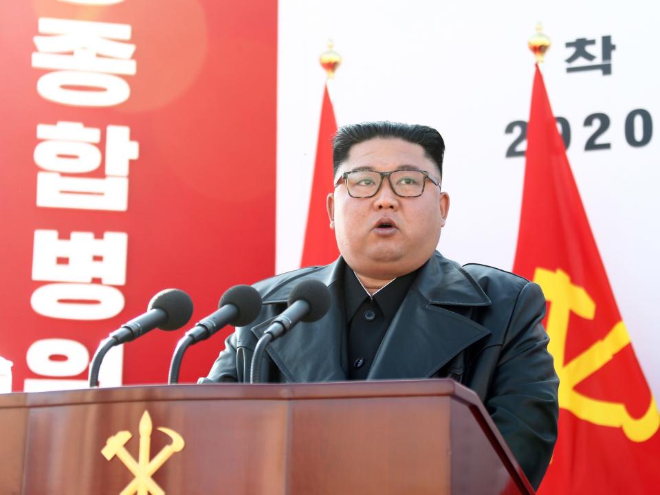 Kim Jong Un speaking at a podium.