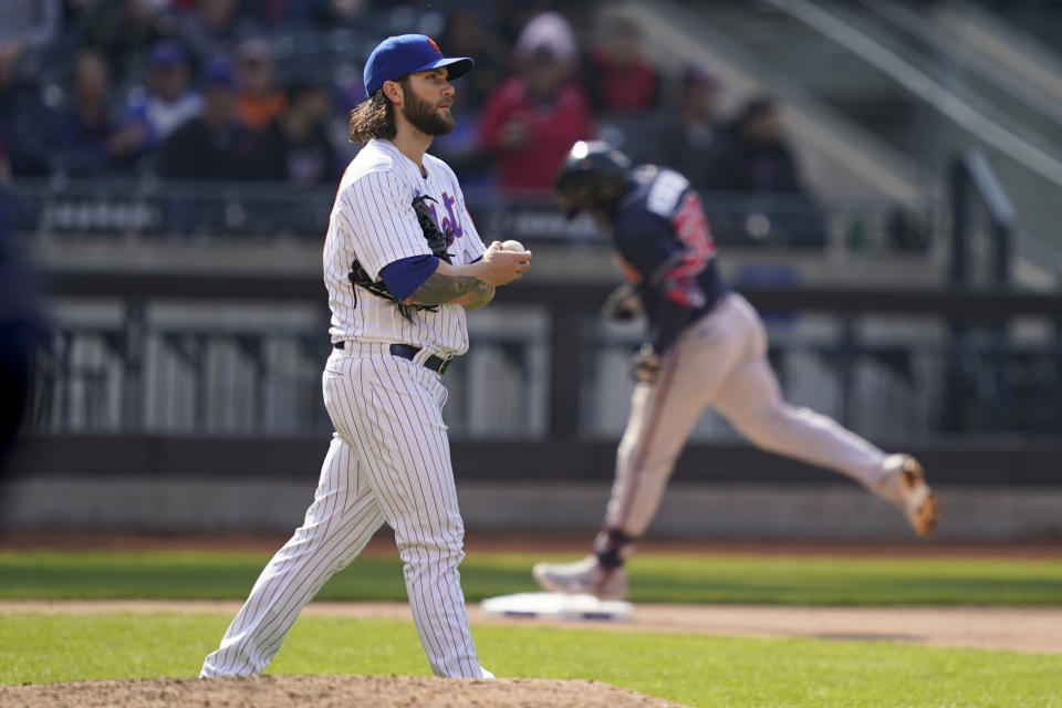 New York Mets starting pitcher Trevor Williams (29) walks up the mound after giving up a two-run home run to Atlanta Braves' Guillermo Heredia in the eighth inning of a baseball game, Wednesday, May 4, 2022, in New York. (AP Photo/John Minchillo)