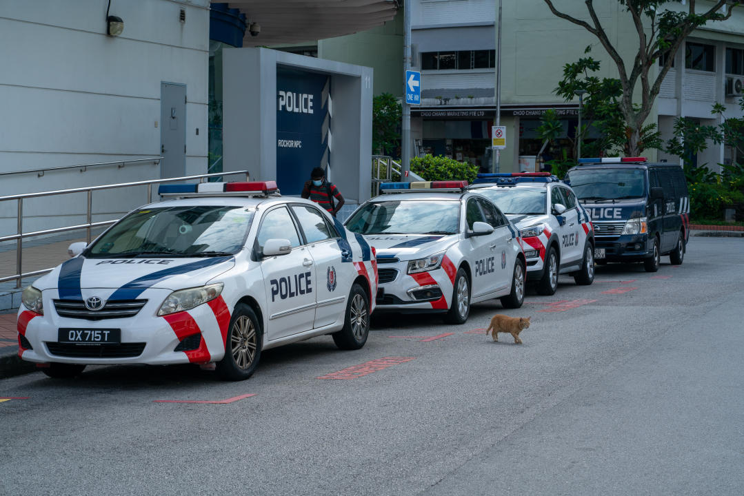 Police cars parked outside Rochor police station in Singapore. (PHOTO: Getty)