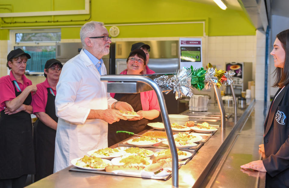 Labour leader Jeremy Corbyn serves students and teachers their school dinners at Bilton High School in Rugby, while on the General Election campaign trail.