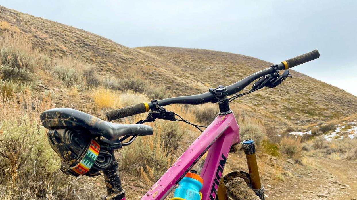 a bicycle parked on a hill