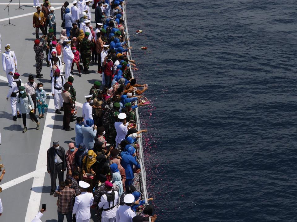 Onlookers pay tribute to the crew members of the sunken KRI Nanggala (402) submarine.