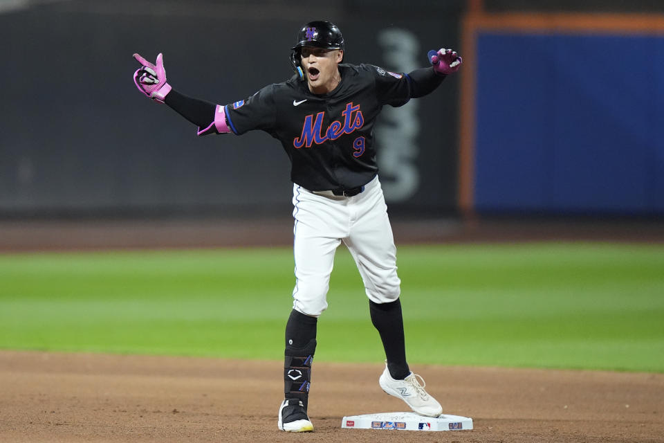 New York Mets' Brandon Nimmo (9) gestures to teammates after hitting an RBI double during the fourth inning of a baseball game against the Philadelphia Phillies, Thursday, Sept. 19, 2024, in New York. (AP Photo/Frank Franklin II)