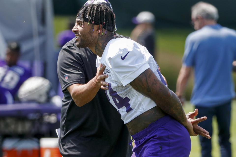 Minnesota Vikings tight end Irv Smith Jr. takes part in drills at the NFL football team's practice facility in Eagan, Minn., Saturday, July 30, 2022. (AP Photo/Bruce Kluckhohn)