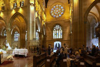 The coffin of Cardinal George Pell lays in state at St. Mary's Cathedral in Sydney, Wednesday, Feb. 1, 2023. Mourners paid their respects to Cardinal George Pell who lay in state in a Sydney cathedral on Wednesday as police sought a court order to prevent protesters from disrupting his funeral. (AP Photo/Rick Rycroft, Pool)