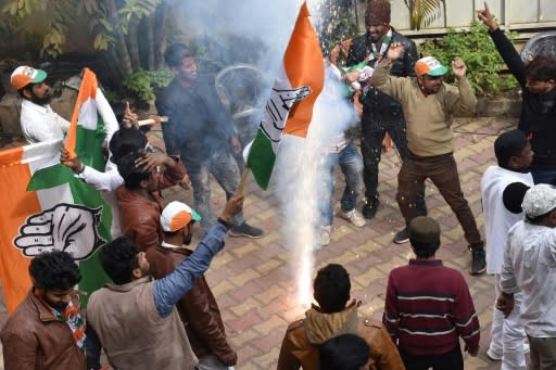 Congress-JMM alliance workers in Ranchi celebrate results projecting an assembly majority in the Jharkhand state election -- bringing more bad news for Prime Minister Narendra Modi