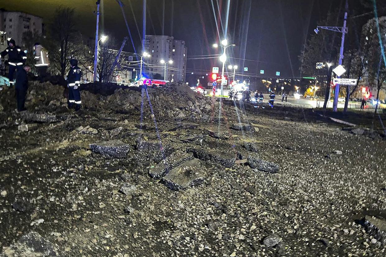 This handout photo released by Telegram Channel of Belgorod Region Governor Vyacheslav Gladkov shows the site of the crater after an explosion in Belgorod, Russia, Friday, April 21, 2023. A large explosion hit Belgorod late Thursday, and the Defense Ministry said one of its Su-34 warplanes accidentally discharged ammunition over the city about 25 kms. (15 miles) from the Ukrainian border. Belgorod Regional Gov. Vyacheslav Gladkov said the blast injured at least two people, damaged homes and left a crater about 20 meters (65 feet) across.(Telegram Channel of Belgorod Region Governor Vyacheslav Gladkov via AP)