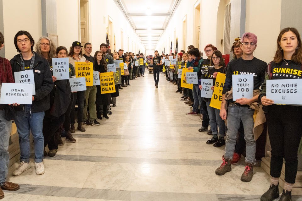 Sunrise Movement protesters inside the office of House Minority Leader Nancy Pelosi (D-Calif.) on Dec. 10 to advocate that Democrats support the Green New Deal. (Photo: SIPA USA/PA Images)