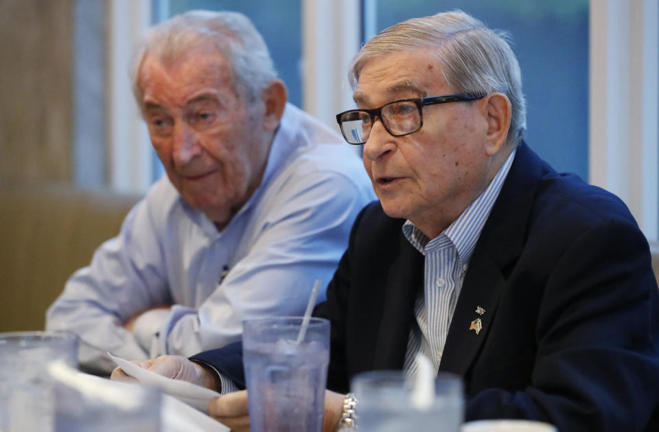 In this, Monday, Oct. 7, 2019 photo, David Mermelstein, right, President of Miami-Dade Holocaust Survivors (and Vice President of the Holocaust Survivors Foundation USA (HSF), speaks during an interview with The Associated Press along with David Schaecter, rear, President of HSF, in Aventura, Fla. Aging Holocaust survivors are trying to recover insurance benefits that were never honored by Nazi-era companies, which could be worth billions of dollars. The companies have demanded original paperwork, such as death certificates, that were not available after World War II. The survivors want to take insurance companies to court in the U.S. to recover the money, but it would take an act of Congress to allow it. (AP Photo/Wilfredo Lee)