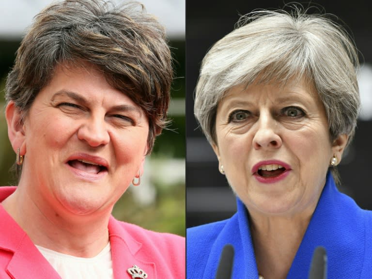 Democratic Unionist Party (DUP) leader Arlene Foster (L) and Theresa May struck a deal on Monday that will afford the British PM's Conservatives a slim majority in the British parliament