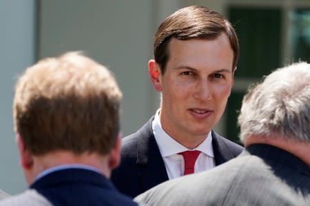 FILE PHOTO: Kushner speaks with guests after U.S. President Trump discussed U.S. immigration policy at the White House in Washington