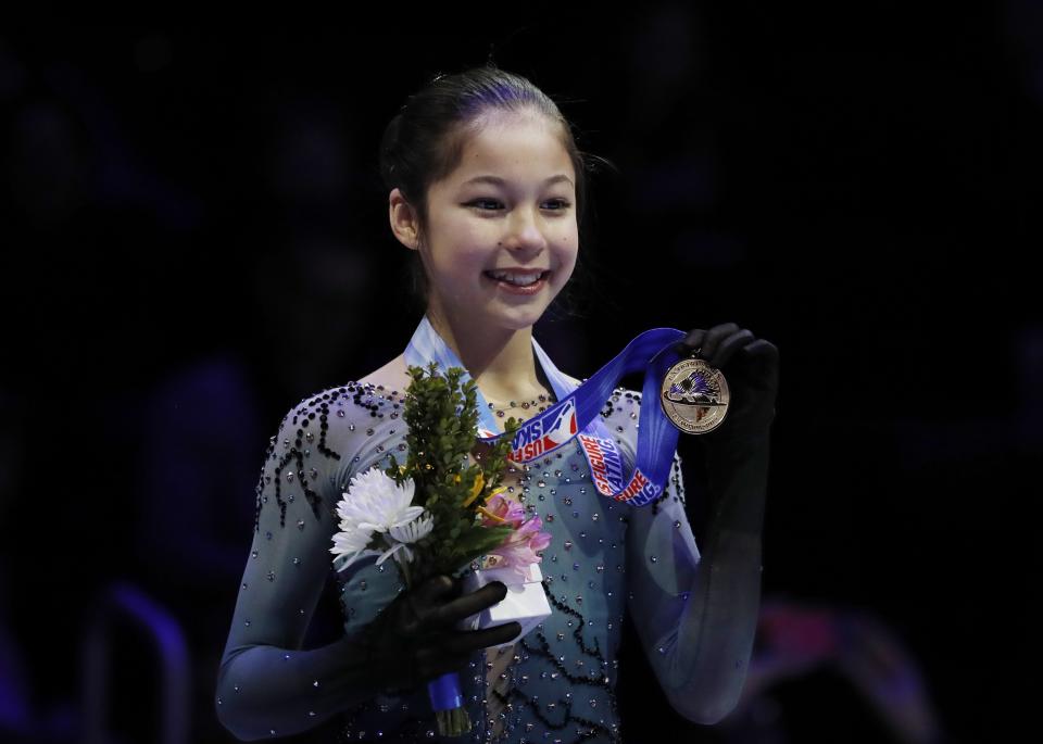 Alysa Liu holds her medal after winning the the women's title during the U.S. Figure Skating Championships, Friday, Jan. 25, 2019, in Detroit. (AP Photo/Carlos Osorio)