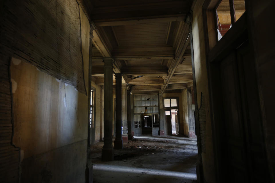 This Saturday, July 21, 2018 photo, shows a view of the Prinkipo orphanage, a 6-floor timber building that once served as an orphanage for children of the minority Greek community, in Buyukada, the largest and most popular of the Princes' Islands in the Sea of Marmara near Istanbul. The 120-year-old gigantic building, occupying 20,000 square meters on a hilltop_ became home for some 5,800 minority Greek children from 1903 until 1964 when it was forced to shut down. (AP Photo/Lefteris Pitarakis)