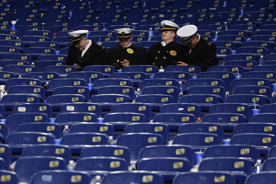 Navy Midshipmen sit in the stands following their 17-11 loss to Army in an NCAA college football game at Gillette Stadium Saturday, Dec. 9, 2023, in Foxborough, Mass. (AP Photo/Winslow Townson)