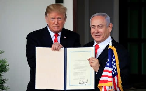 Donald Trump and Mr Netanyahu after the US recognised Israeli sovereignty over the Golan Heights - Credit: AP Photo/Manuel Balce Ceneta, File