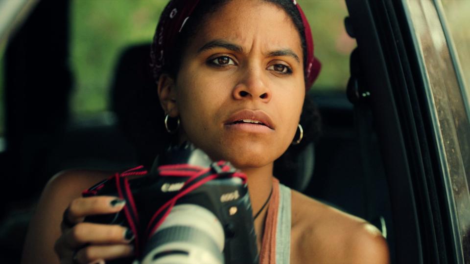 Zazie Beetz holds a camera in Black Mirror season 6