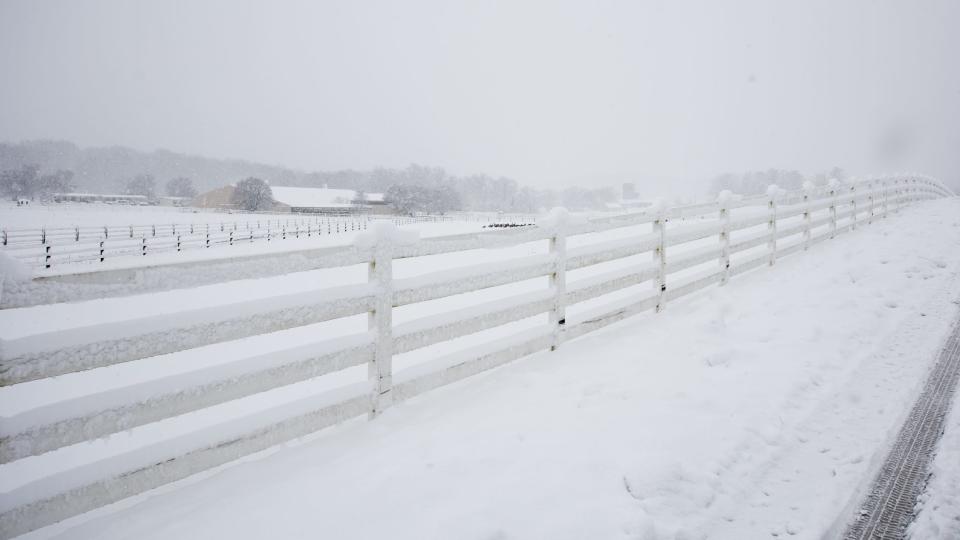 Snow blankets farmland at Delaware Valley University, in New Britain Borough, during a snow storm Tuesday, February, 13, 2024.