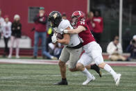 Purdue's Payne Durham, left, is tackled by Indiana's Kaiden Turner (14) during the first half of an NCAA college football game, Saturday, Nov. 26, 2022, in Bloomington, Ind. (AP Photo/Darron Cummings)