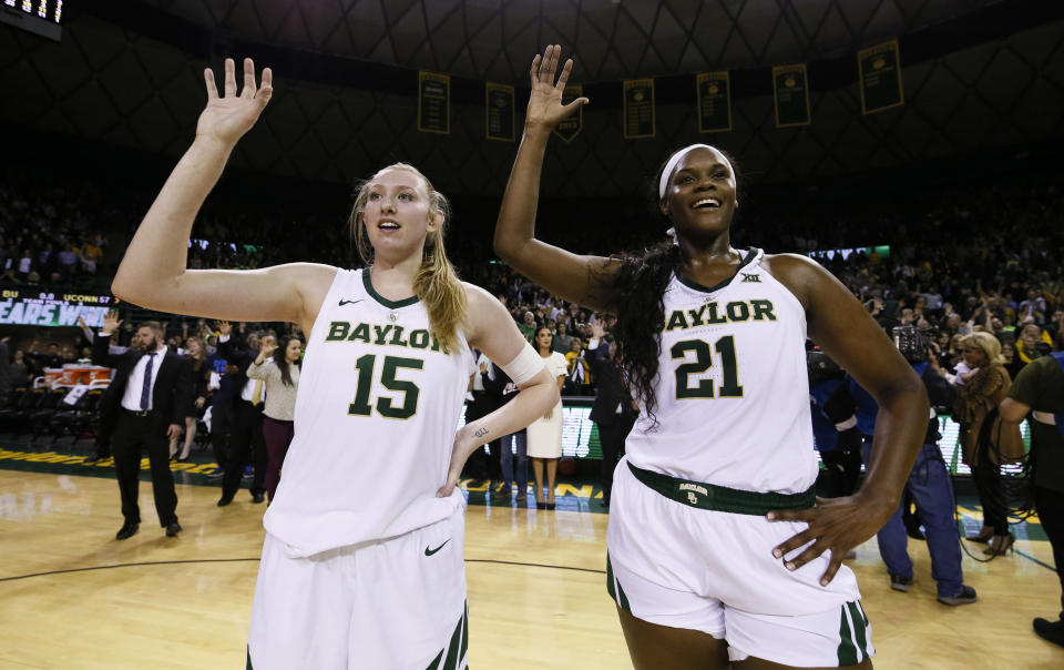 Baylor forward Lauren Cox (15) and center Kalani Brown (21) stand during the playing of the school fight song following the team's 68-57 victory over No. 1 Connecticut in an NCAA college basketball game Thursday, Jan. 3, 2019, in Waco, Texas. (AP Photo/Ray Carlin)