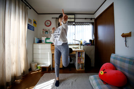 Nao Niitsu, 19, a college freshman from Tokyo, who wants to be a K-pop star, practices dancing to K-pop songs in her room in Tokyo, Japan, March 20, 2019. REUTERS/Kim Kyung-Hoon