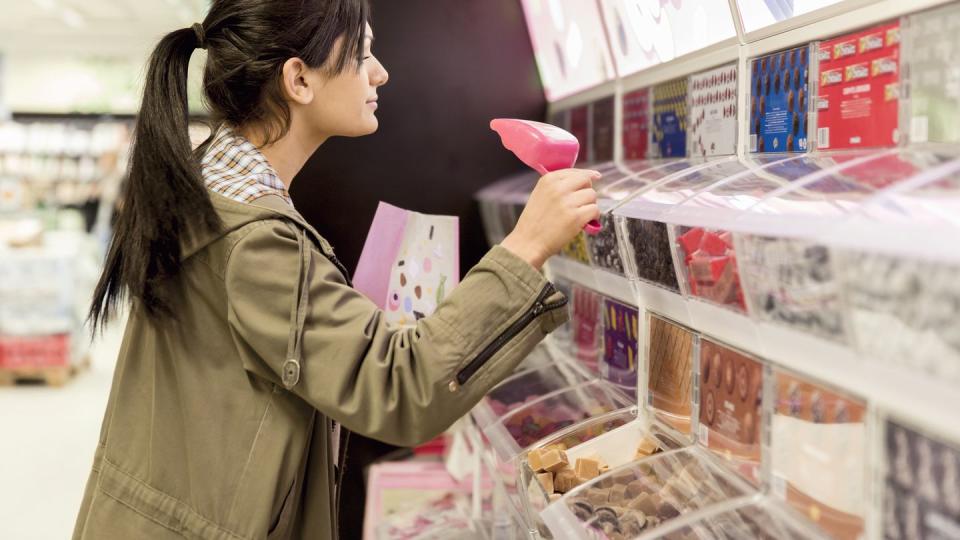 woman buying candy