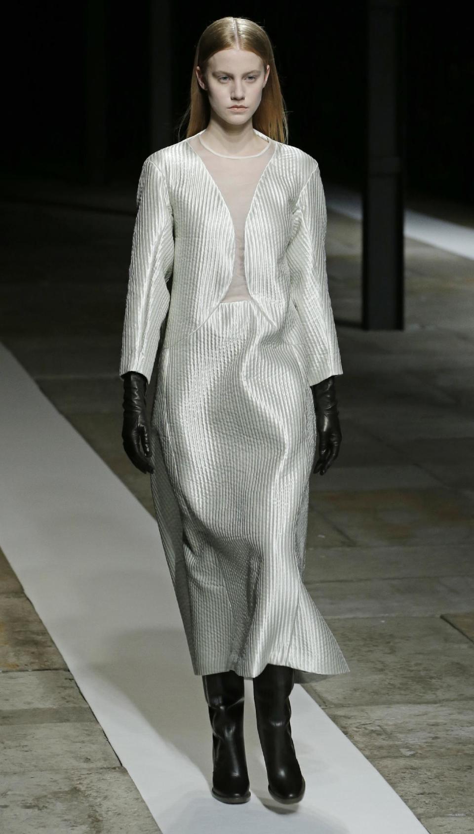 A model walks the runway during the Theyskens Theory Fall 2013 runway show at Fashion Week in New York, Monday, Feb. 11, 2013. (AP Photo/Kathy Willens)