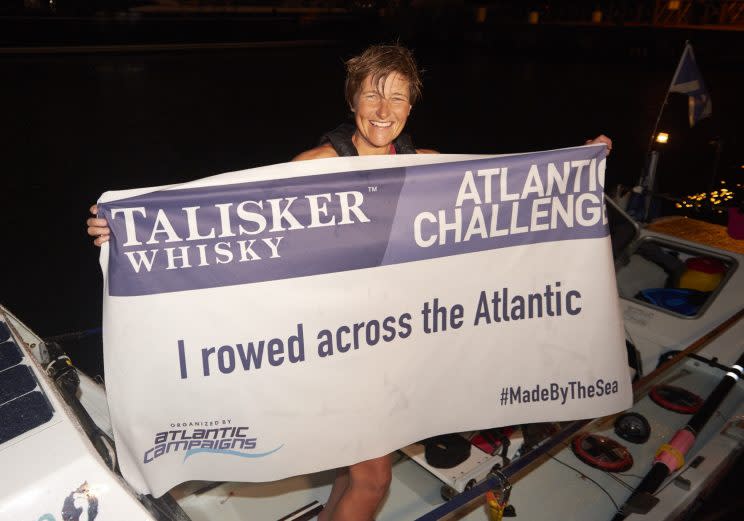 A mother-of-two has rowed her way into the record books, becoming the fastest woman to cross the Atlantic in the history of a gruelling race.